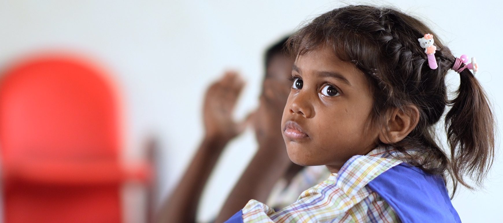 Young girl from Agape orphanage in Hyderabad, India wearing school uniform — NGO providing HIV/AIDS orphan children with education, support, and a safe home